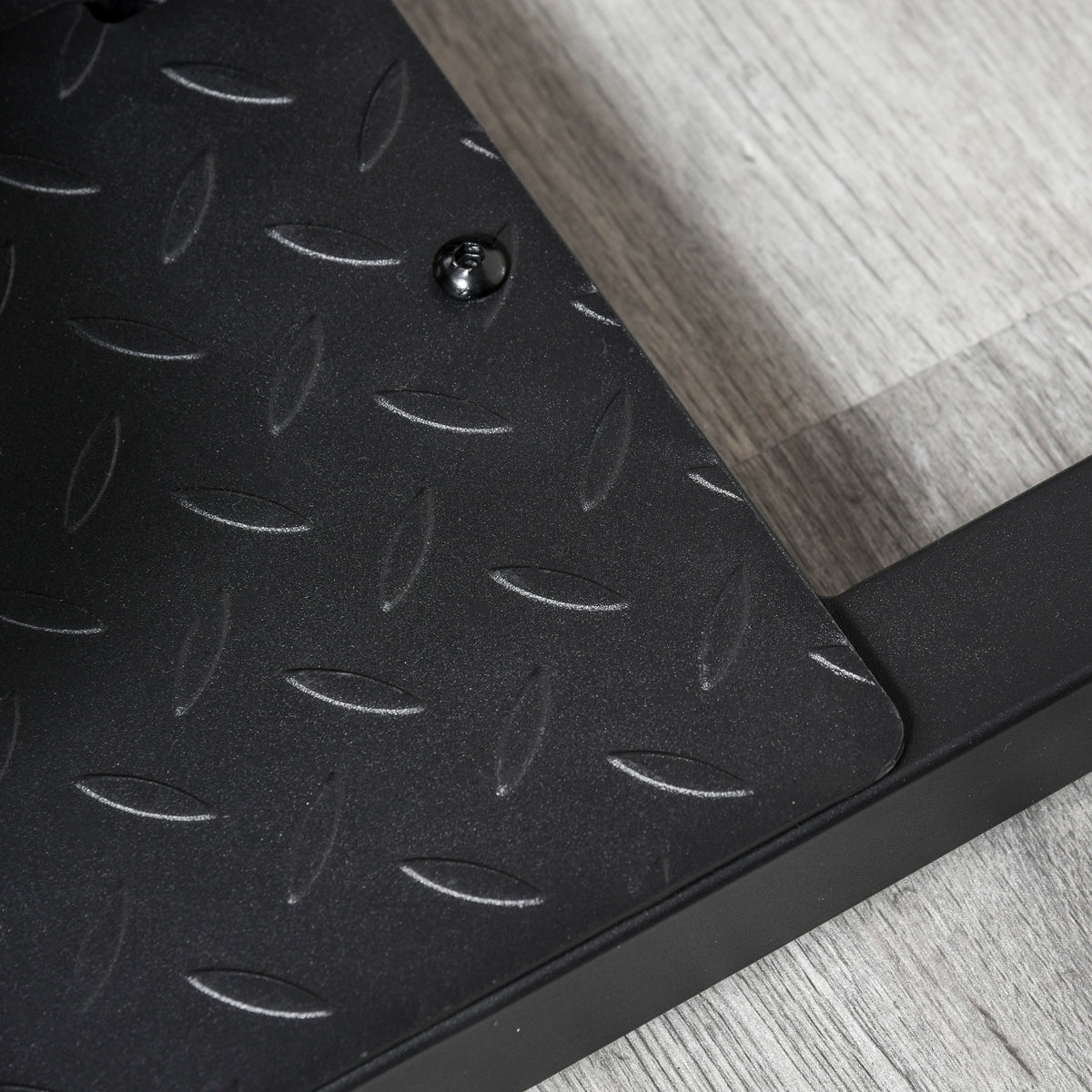 Close-up of the textured foot platform on the 3-in-1 home gym machine